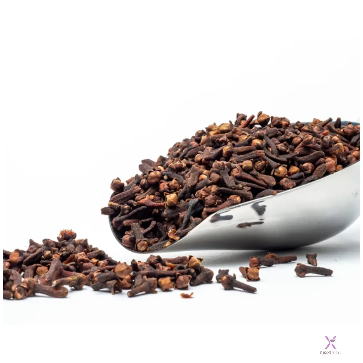 Cloves in a metal scoop on a white background